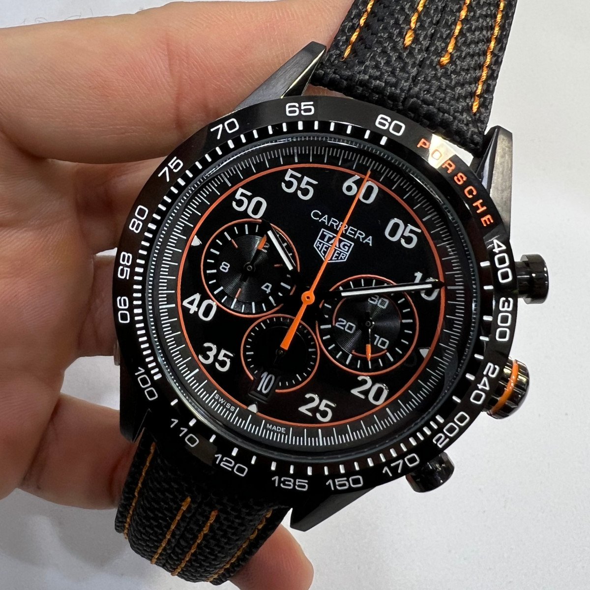 a43f4e_bfe7581a15db43e9b6c643e13fe9227cmv2 TAG Heuer Carrera Chronograph x Porsche, Aço 44mm Pulseira Lona - Imagem 1