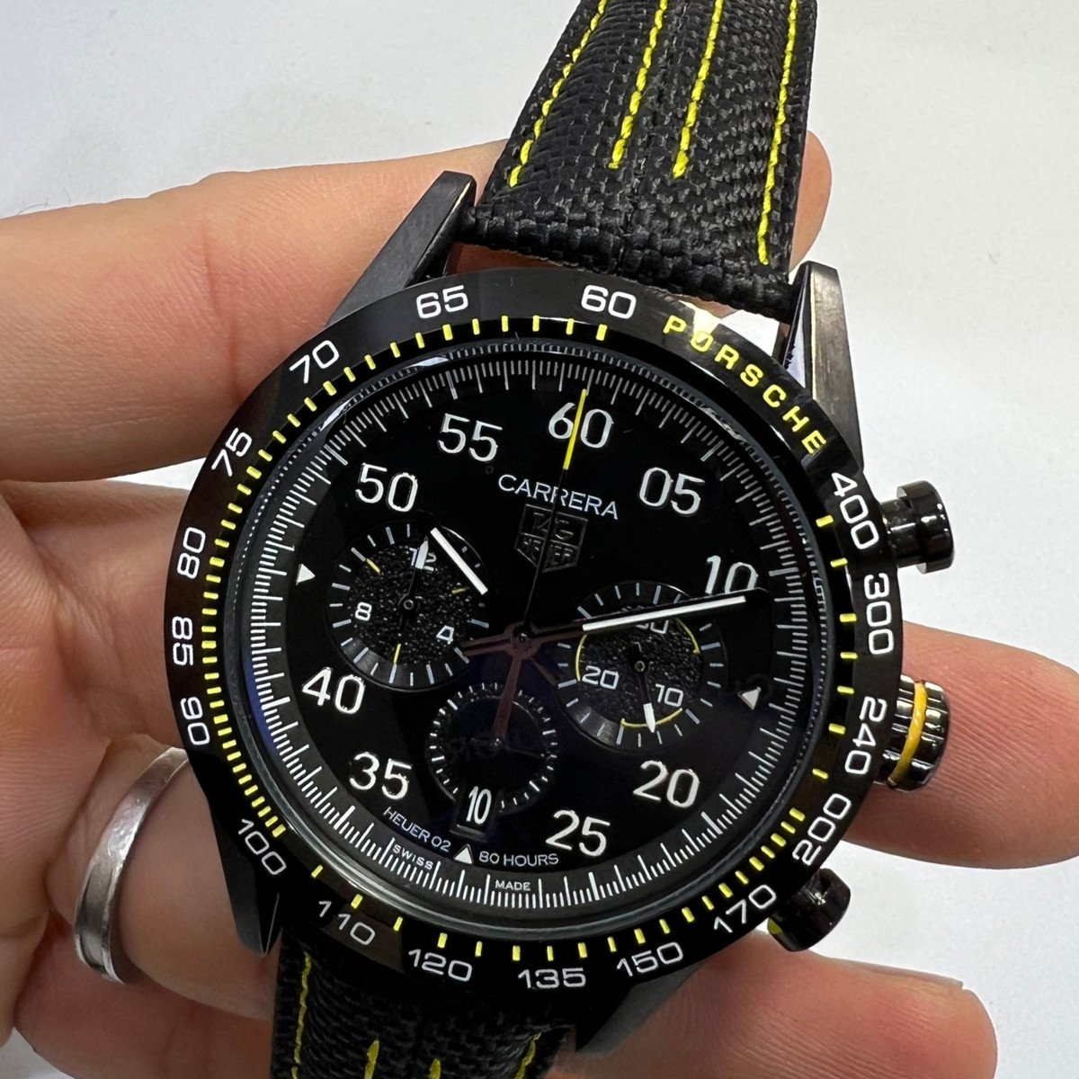 a43f4e_fa269b45305a432db2247901720b2279mv2 TAG Heuer Carrera Chronograph x Porsche, Aço 44mm Pulseira Lona - Imagem 1